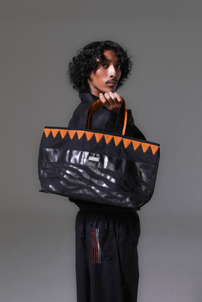 Mascha Tote Bag made from durable canvas with contrast lining, featuring triangle appliqué, hand-stitch details, and a zebra-patterned motif in repurposed Terpal, designed with an internal pomet for everyday use.