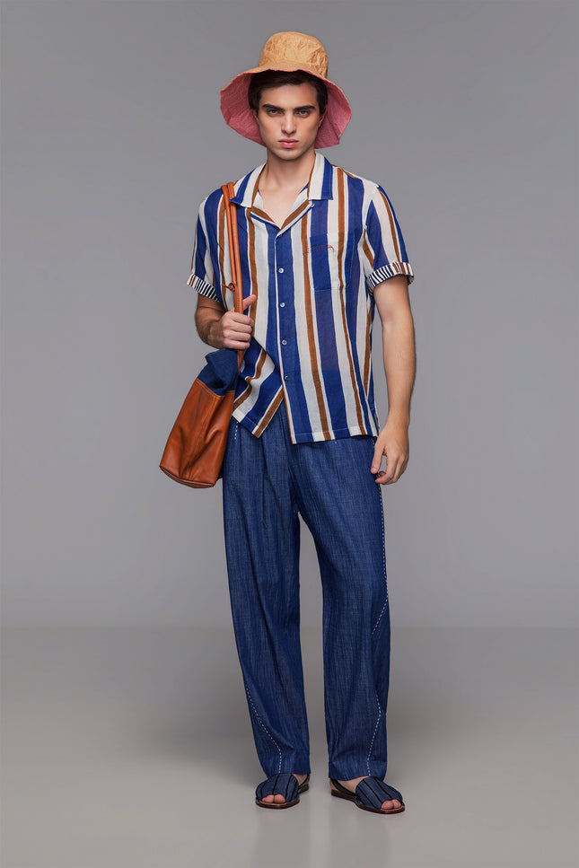 Model wearing cotton camp shirt with handmade block print, contrast sleeves, and notch collar.