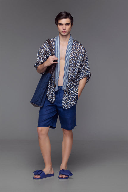 Model wearing Lugh Shorts in pure linen with elastic waistband and adjustable drawstrings that are effortlessly comfortable and timeless for resort or summer wear.