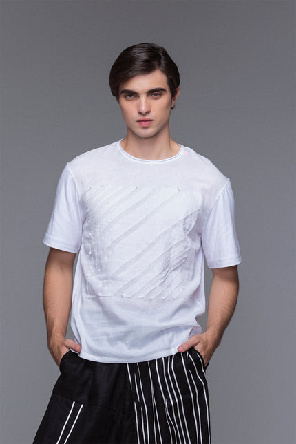 Model wearing Black Marko T-Shirt with short sleeves, round neckline, square striped applique, and contrast fabric details.