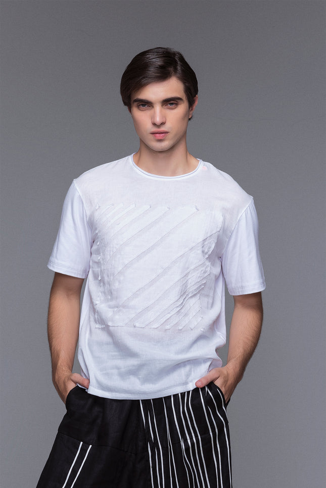 Model wearing Black Marko T-Shirt with short sleeves, round neckline, square striped applique, and contrast fabric details.