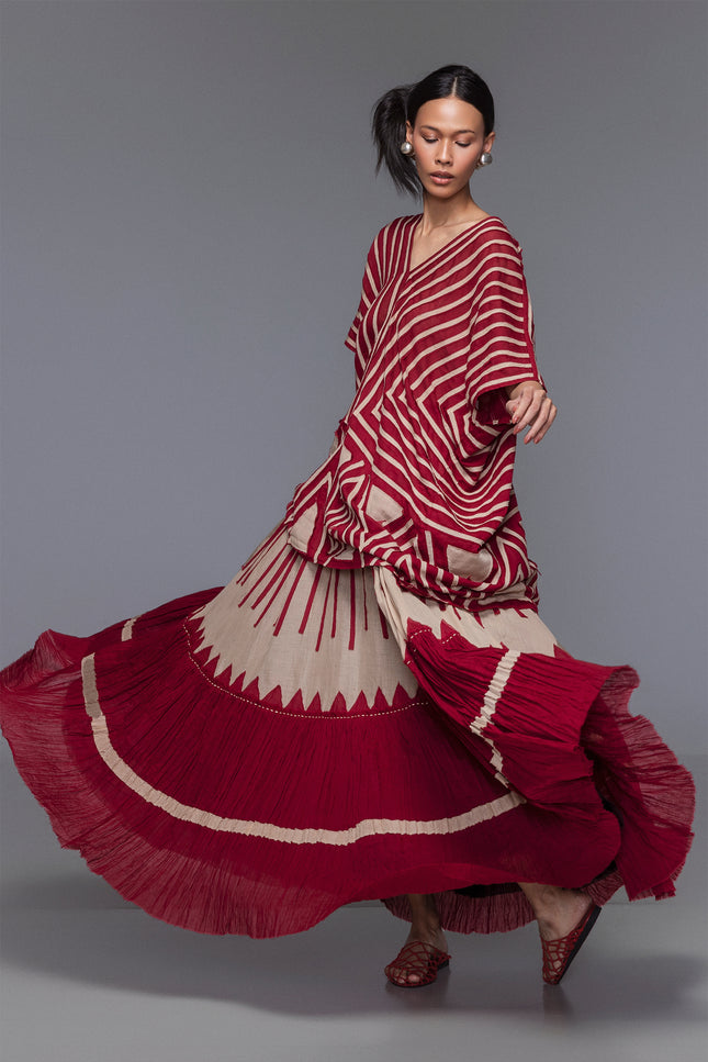 Model wearing Makota Maxi Skirt in lightweight cotton with A-line silhouette, vertical applique, and crinkled bottom panel.