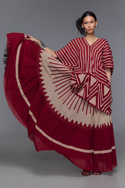 Model wearing Makota Maxi Skirt in lightweight cotton with A-line silhouette, vertical applique, and crinkled bottom panel.