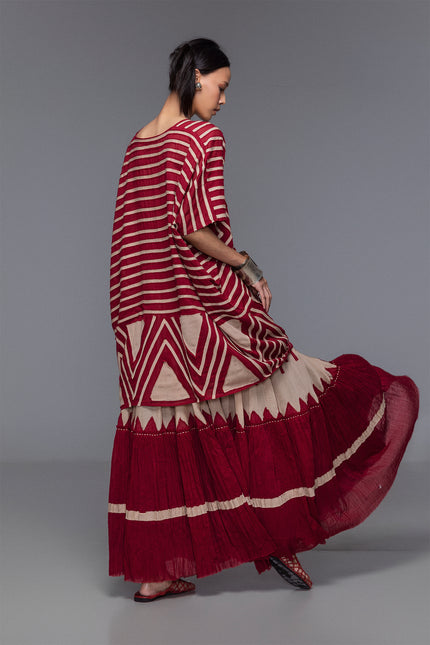 Model wearing Makota Maxi Skirt in lightweight cotton with A-line silhouette, vertical applique, and crinkled bottom panel.