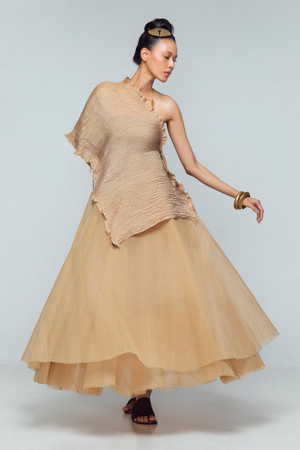 Model wearing a silk satin scarf with pintuck detailing, styled as a flowing layered piece with adjustable straps.