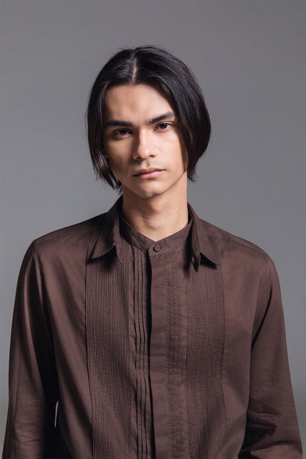 Model wearing Mauro Long-Sleeve Shirt in lightweight cotton, featuring a hidden placket, Indian pintuck detailing, and detachable collar leaf.