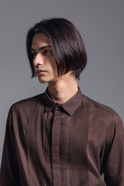 Model wearing Mauro Long-Sleeve Shirt in lightweight cotton, featuring a hidden placket, Indian pintuck detailing, and detachable collar leaf.