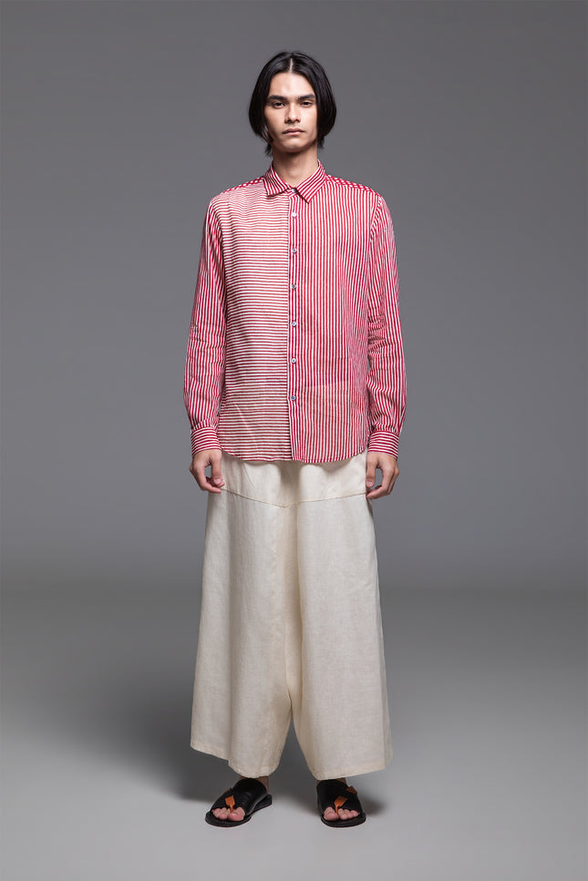 Model wearing Osmont Shirt in pure cotton, featuring a regular-fit silhouette, collared neckline, structured cuffs, and mixed-orientation block print.