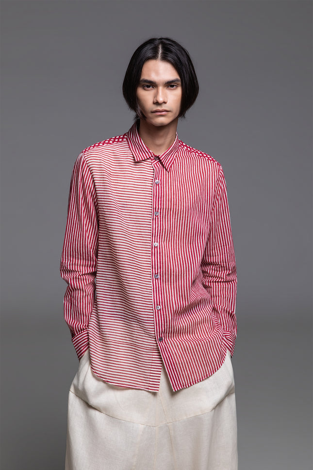 Model wearing Osmont Shirt in pure cotton, featuring a regular-fit silhouette, collared neckline, structured cuffs, and mixed-orientation block print.