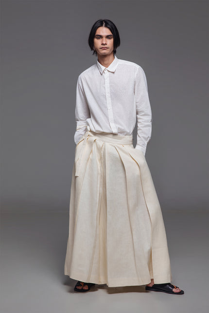 Model wearing Calli Shirt in pure cotton, featuring a classic silhouette with subtle stingray-inspired block-print pattern.