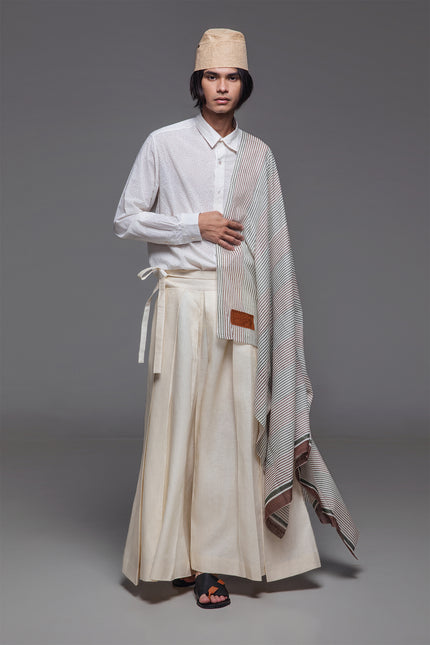 Model wearing Calli Shirt in pure cotton, featuring a classic silhouette with subtle stingray-inspired block-print pattern.