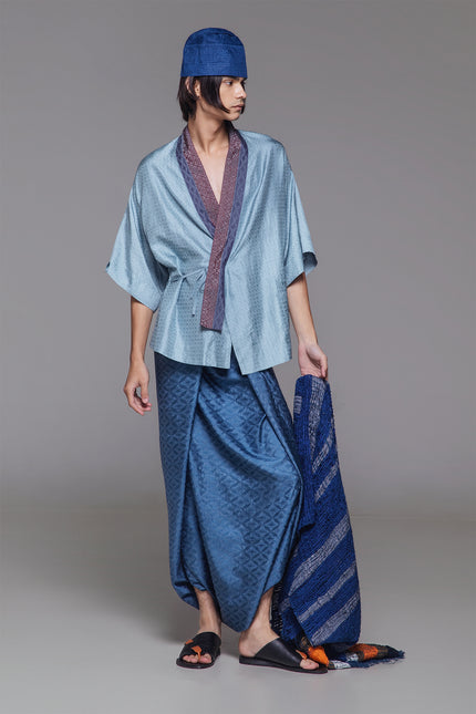 Model wearing Natsu Kimono in jacquard silk, featuring a relaxed silhouette, wide mid-length sleeves, and a structured collar with subtle textured finish.