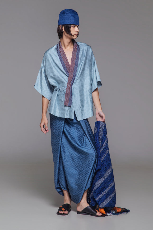 Model wearing Natsu Kimono in jacquard silk, featuring a relaxed silhouette, wide mid-length sleeves, and a structured collar with subtle textured finish.