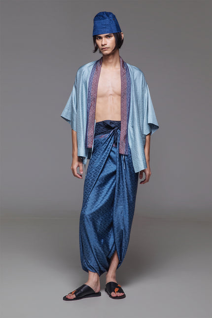 Model wearing Natsu Kimono in jacquard silk, featuring a relaxed silhouette, wide mid-length sleeves, and a structured collar with subtle textured finish.
