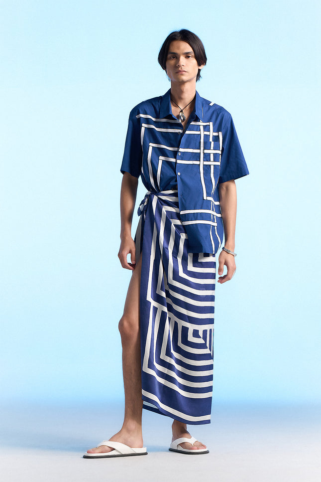 Model wearing Noga Camp Shirt in lightweight cotton, featuring reflected stripe applique, a regular-fit silhouette, and a seamless patch pocket.