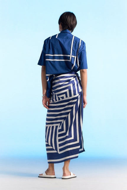 Model wearing Noga Camp Shirt in lightweight cotton, featuring reflected stripe applique, a regular-fit silhouette, and a seamless patch pocket.
