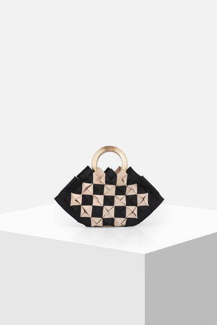 Nerium Mini Handbag with a sculptural hexagonal silhouette, origami-inspired textured cotton body, and handmade brass gold plate handle.