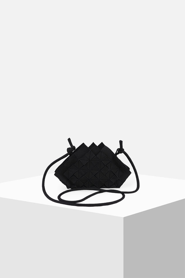 Nemesia Mini Sling Bag made from cotton with origami-inspired geo flower appliqué, featuring a detachable spaghetti strap for crossbody or handheld use.