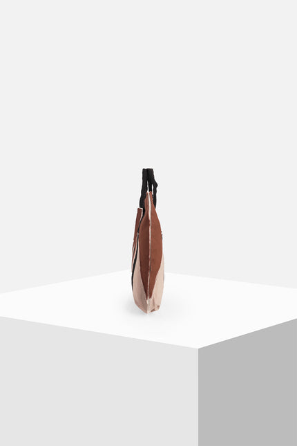 Multicolor cotton canvas tote bag with appliqué panels, contrast hand stitching, and Lagos motif lining.