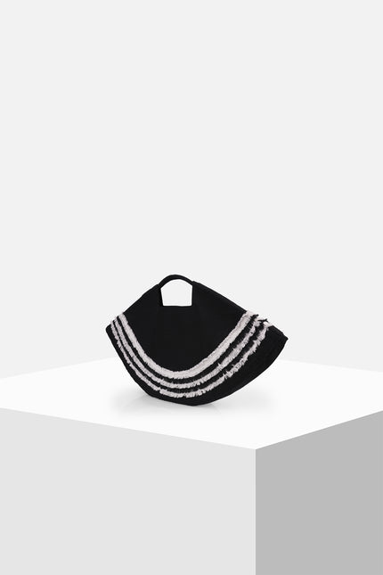 Biandsy bag with a semicircular black silhouette, double cord handles, and handmade white fringe appliqué creating a textured monochrome finish.
