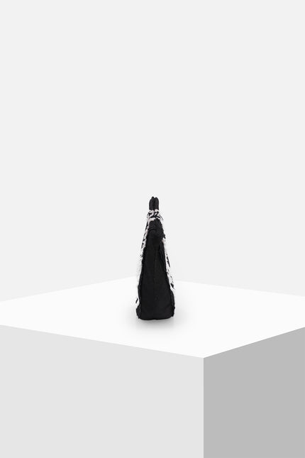 Biandsy bag with a semicircular black silhouette, double cord handles, and handmade white fringe appliqué creating a textured monochrome finish.