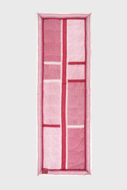 Model wearing the Ondrey Scarf in 100% cotton, featuring assorted handmade block-print patterns and double-color fringe stripes along the center and edges.