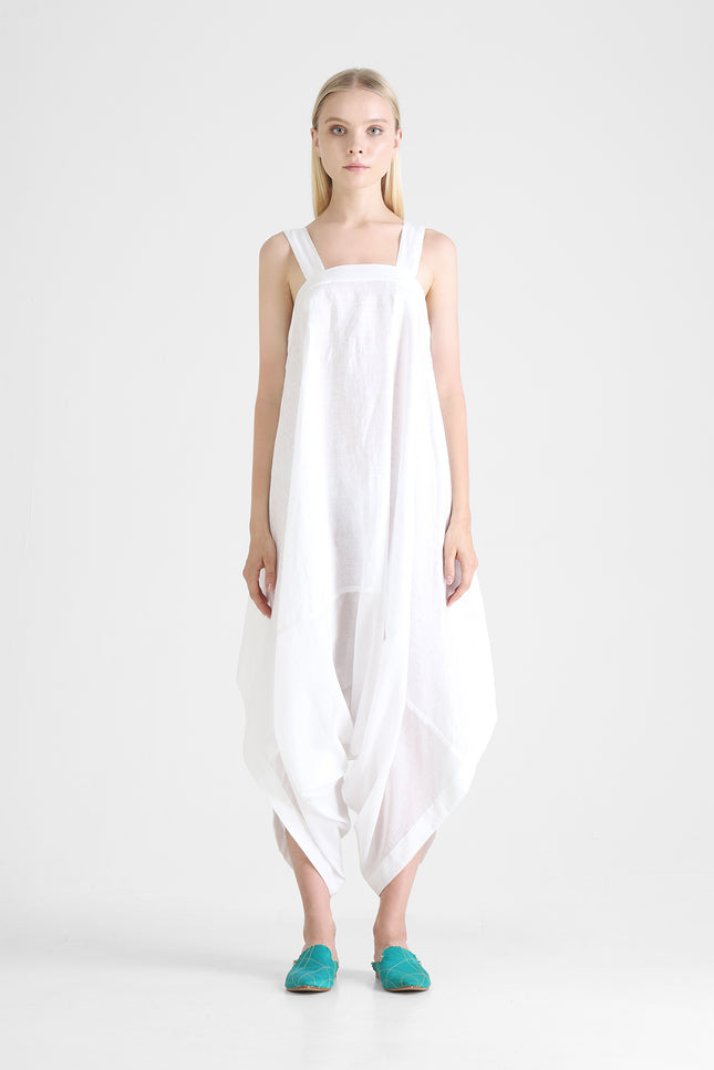 Dual fabric jumpsuit with square framed neckline and irregular hemline